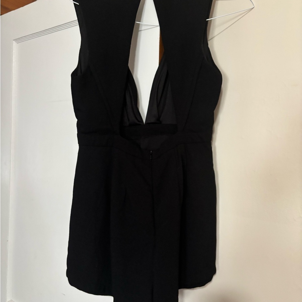 Source Unknown Black Onesie with Silver Tag